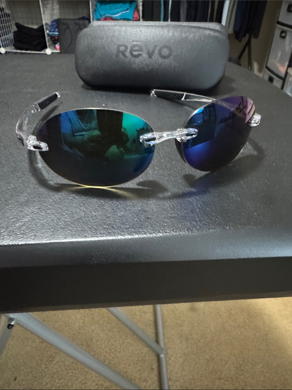 Revo Rimless Sunglasses with Clear Frame and Blue-Green Mirrored Lenses